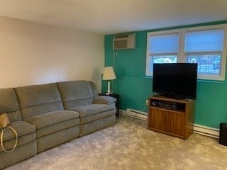 carpeted living room with a wall unit AC and a baseboard heating unit