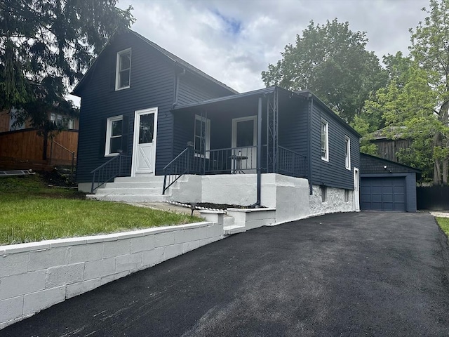 45 Carter Ave, Blackstone, MA 01504 - view of front of property featuring a detached garage, covered porch, an outbuilding, and driveway