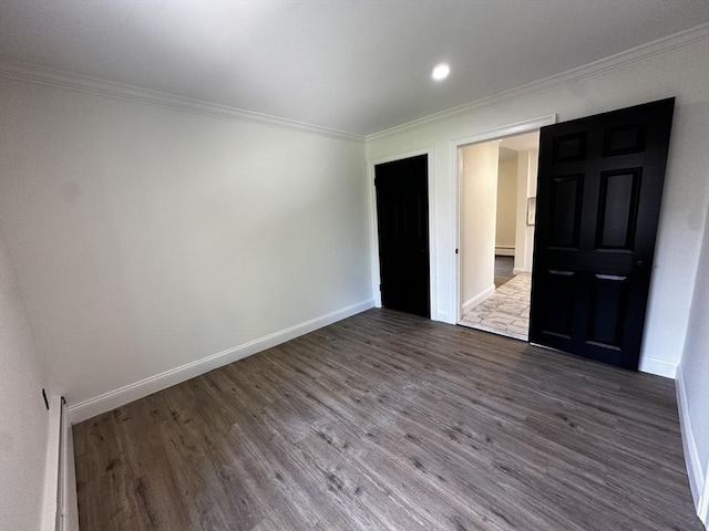 45 Carter Ave, Blackstone, MA 01504 - empty room with wood finished floors, crown molding, baseboards, a baseboard heating unit, and recessed lighting