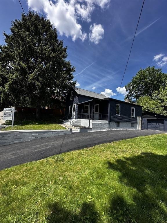 45 Carter Ave, Blackstone, MA 01504 - view of front facade featuring a front yard and a garage