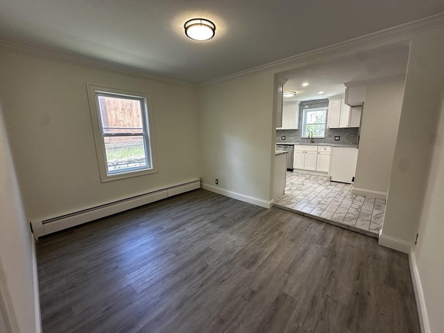 45 Carter Ave, Blackstone, MA 01504 - unfurnished living room with a baseboard radiator, a sink, wood finished floors, crown molding, and baseboards