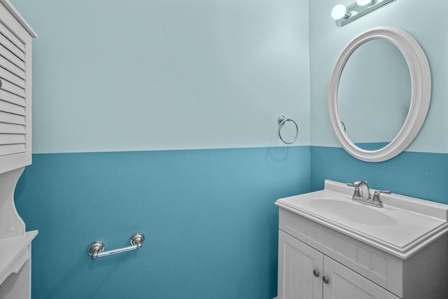 half bath featuring vanity
