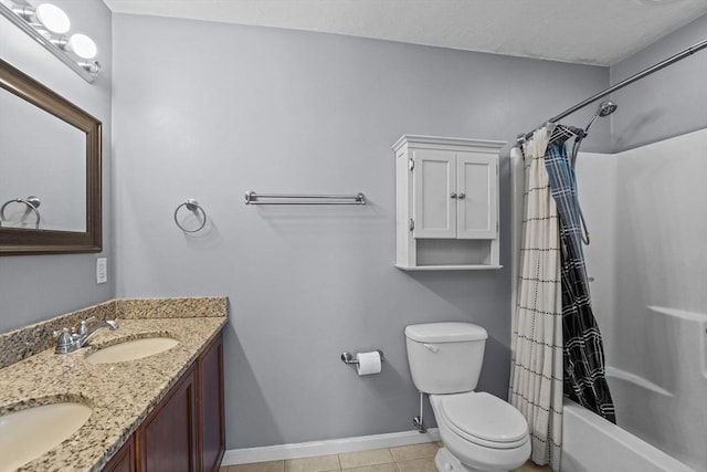 bathroom with baseboards, toilet, shower / bath combo, double vanity, and tile patterned flooring