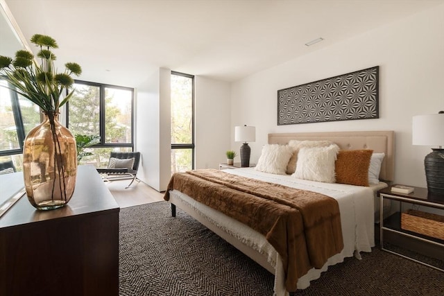 bedroom featuring a wall of windows