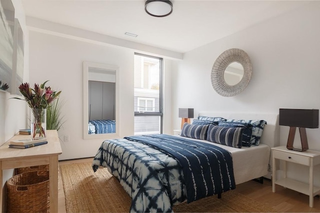 bedroom with wood-type flooring