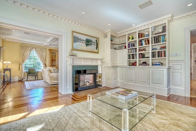 10 Sheffield Rd, Winchester, MA 01890 - living area featuring crown molding, a glass covered fireplace, wood finished floors, and recessed lighting