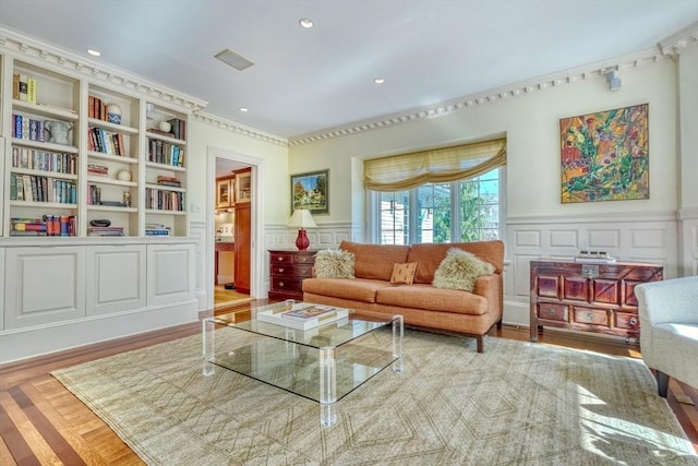 10 Sheffield Rd, Winchester, MA 01890 - living room with a decorative wall, wainscoting, crown molding, and recessed lighting
