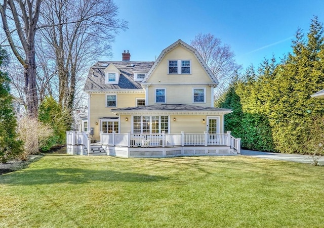 10 Sheffield Rd, Winchester, MA 01890 - rear view of property with a lawn, a chimney, a gambrel roof, and a deck