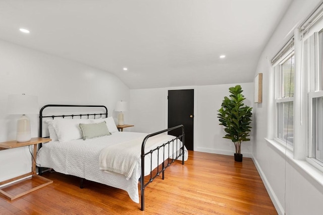 379 Dedham Ave, Needham, MA 02492 - bedroom with lofted ceiling, light wood-type flooring, recessed lighting, and baseboards
