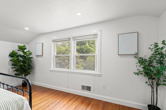 379 Dedham Ave, Needham, MA 02492 - bedroom featuring vaulted ceiling, baseboards, light wood-style floors, and recessed lighting