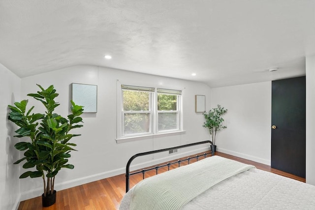 379 Dedham Ave, Needham, MA 02492 - bedroom with vaulted ceiling, wood finished floors, baseboards, and recessed lighting