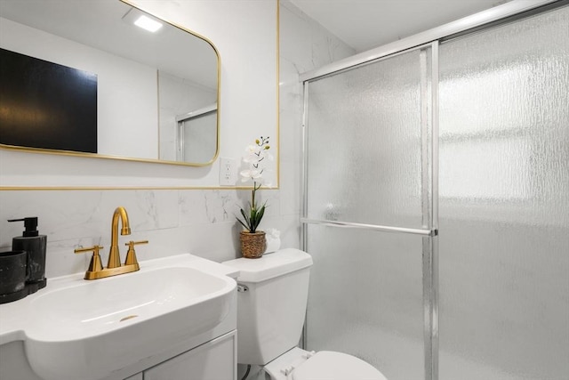 379 Dedham Ave, Needham, MA 02492 - full bathroom with tile walls, a shower stall, toilet, and vanity