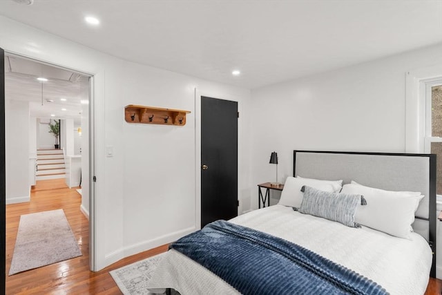 379 Dedham Ave, Needham, MA 02492 - bedroom featuring attic access, wood finished floors, recessed lighting, and baseboards