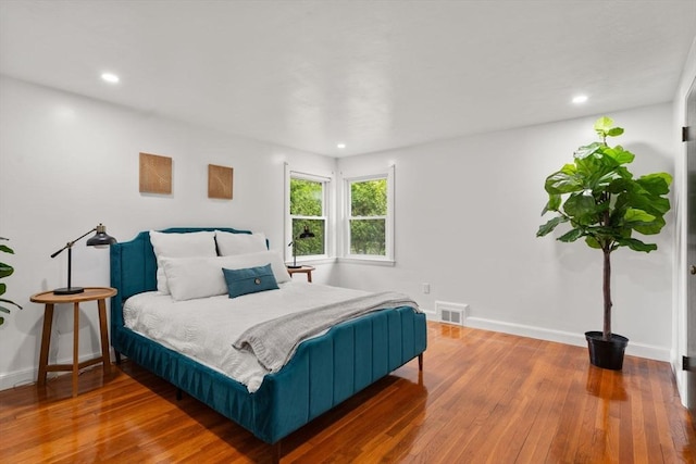 379 Dedham Ave, Needham, MA 02492 - bedroom with hardwood / wood-style flooring, recessed lighting, and baseboards