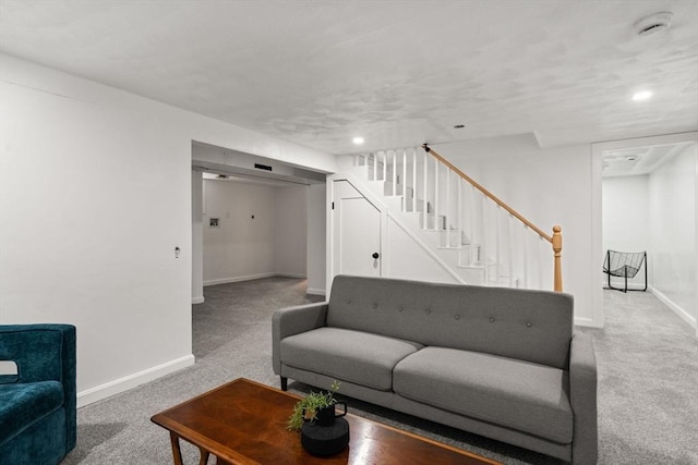 379 Dedham Ave, Needham, MA 02492 - living area with light colored carpet, baseboards, and stairs
