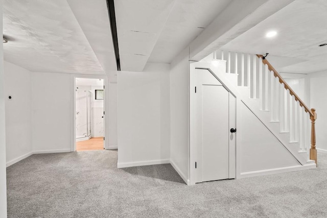 379 Dedham Ave, Needham, MA 02492 - finished basement featuring carpet flooring, baseboards, and stairway