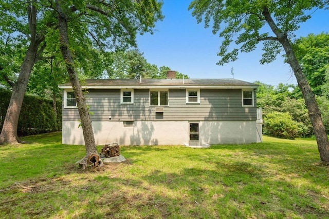 379 Dedham Ave, Needham, MA 02492 - rear view of property with a yard and a chimney