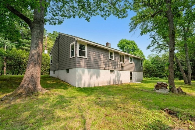 379 Dedham Ave, Needham, MA 02492 - view of home's exterior with a yard