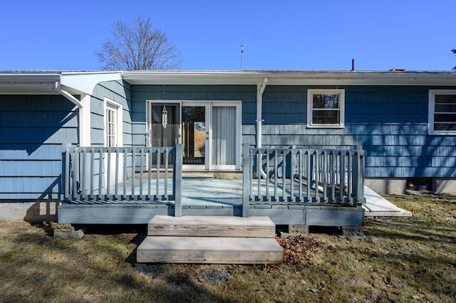 back of house featuring a deck