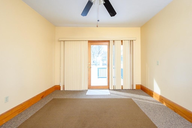 doorway to outside with ceiling fan, carpet floors, and baseboards