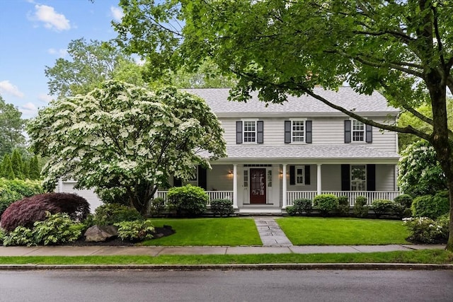 28 Pleasant View Rd, Arlington, MA 02476 - view of front facade with covered porch, a front lawn, and roof with shingles