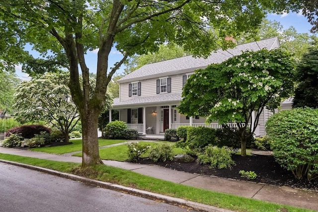 28 Pleasant View Rd, Arlington, MA 02476 - view of front of house with a porch, a shingled roof, and a front yard