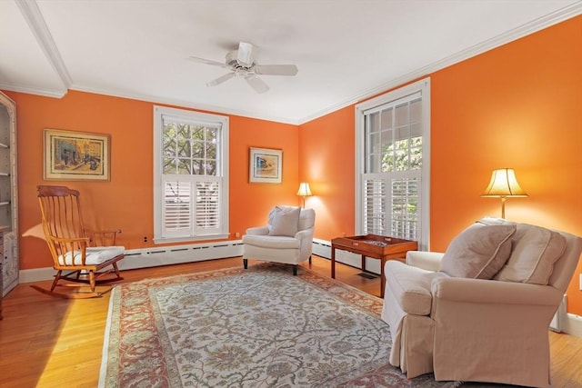 28 Pleasant View Rd, Arlington, MA 02476 - living area with plenty of natural light, ornamental molding, light wood-type flooring, a ceiling fan, and a baseboard heating unit