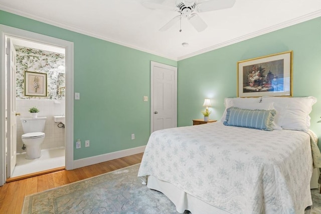 28 Pleasant View Rd, Arlington, MA 02476 - bedroom with wood finished floors, connected bathroom, crown molding, and ceiling fan