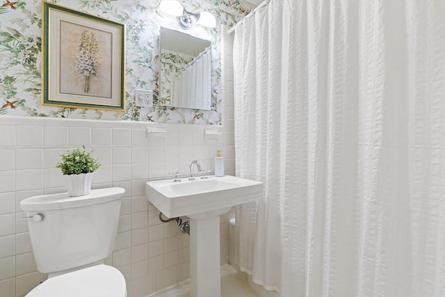 28 Pleasant View Rd, Arlington, MA 02476 - bathroom featuring wallpapered walls, wainscoting, tile walls, and a shower with shower curtain