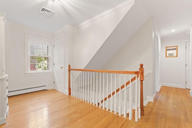 28 Pleasant View Rd, Arlington, MA 02476 - hall with baseboard heating, crown molding, an upstairs landing, light wood finished floors, and attic access