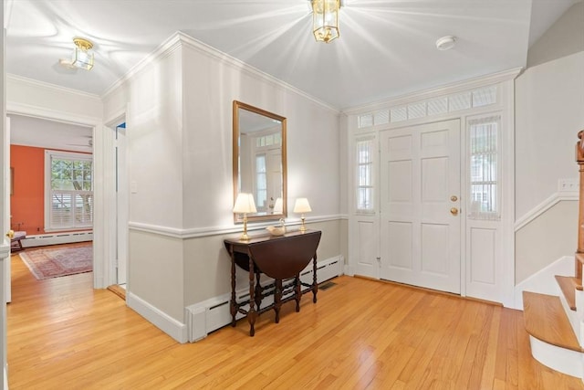 28 Pleasant View Rd, Arlington, MA 02476 - entrance foyer with baseboard heating, light wood-style flooring, crown molding, and stairway