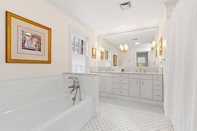 28 Pleasant View Rd, Arlington, MA 02476 - full bath with double vanity, plenty of natural light, a chandelier, a garden tub, and crown molding