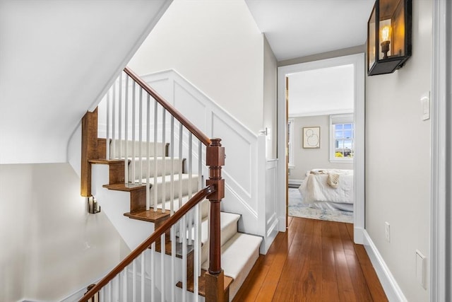 stairs with hardwood / wood-style floors