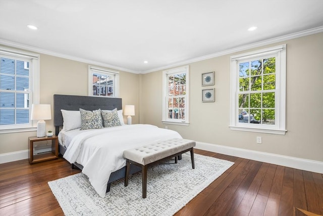 bedroom featuring crown molding and dark hardwood / wood-style floors