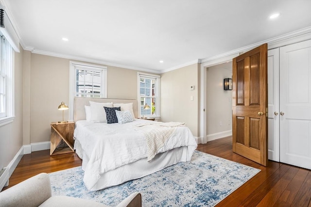 bedroom with dark hardwood / wood-style flooring and ornamental molding