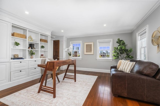 office with a wealth of natural light, dark wood-type flooring, and ornamental molding