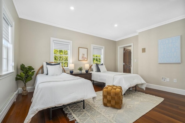 bedroom with crown molding and hardwood / wood-style flooring