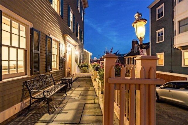 view of patio terrace at dusk