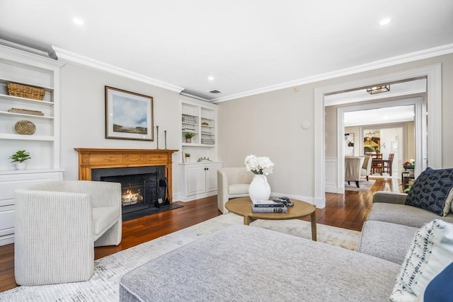 living room featuring dark hardwood / wood-style floors and ornamental molding