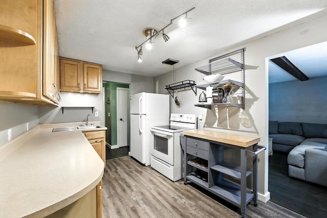 149 N Main St, South Hadley, MA 01075 - kitchen featuring open shelves, white appliances, and light wood finished floors