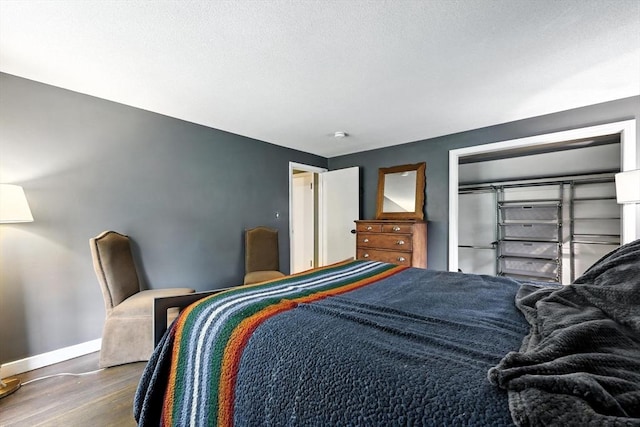 149 N Main St, South Hadley, MA 01075 - bedroom featuring baseboards and wood finished floors