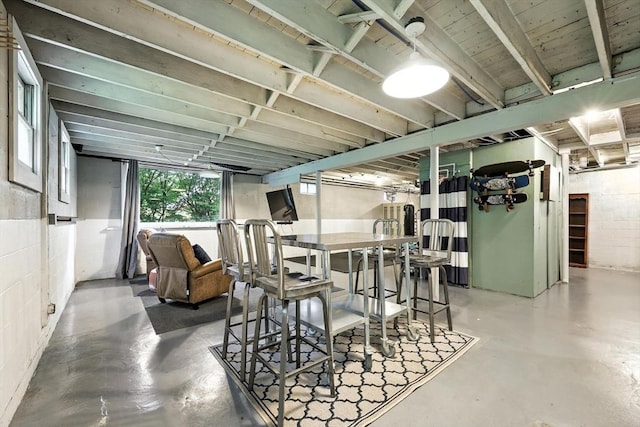 149 N Main St, South Hadley, MA 01075 - dining area with concrete floors and concrete block wall