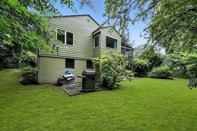 149 N Main St, South Hadley, MA 01075 - rear view of property with a yard and stucco siding