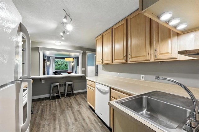 149 N Main St, South Hadley, MA 01075 - kitchen with white appliances, wood finished floors, light countertops, rail lighting, and a textured ceiling
