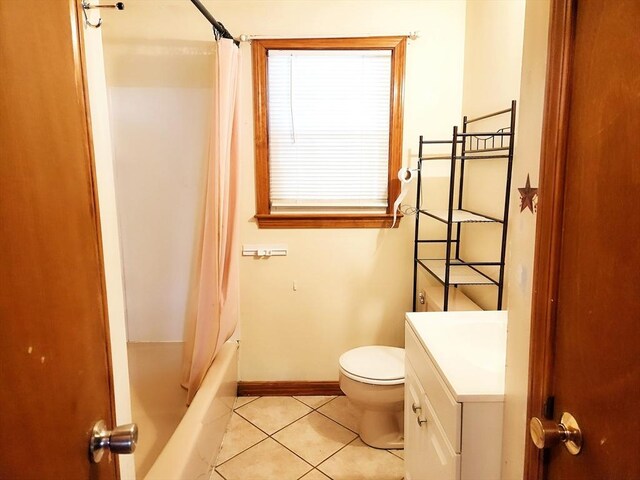 full bathroom with shower / bath combo with shower curtain, tile patterned flooring, vanity, and toilet