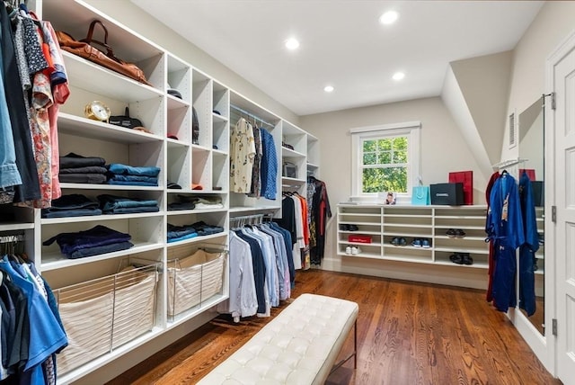 spacious closet featuring dark wood-type flooring and visible vents