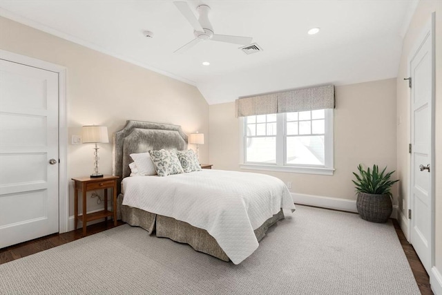 bedroom with visible vents, baseboards, lofted ceiling, dark wood-style floors, and ceiling fan