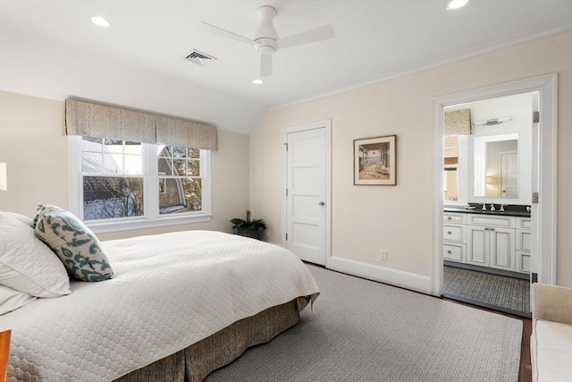 bedroom featuring recessed lighting, visible vents, a sink, ensuite bath, and baseboards