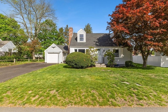 cape cod house with aphalt driveway, fence, a chimney, and a front yard