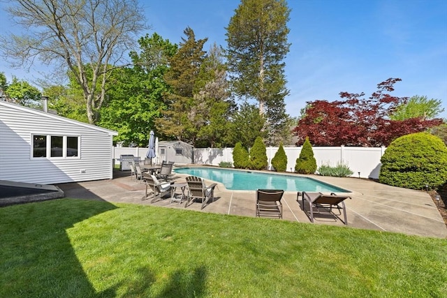 view of pool with a yard, a patio, a fenced in pool, and a fenced backyard